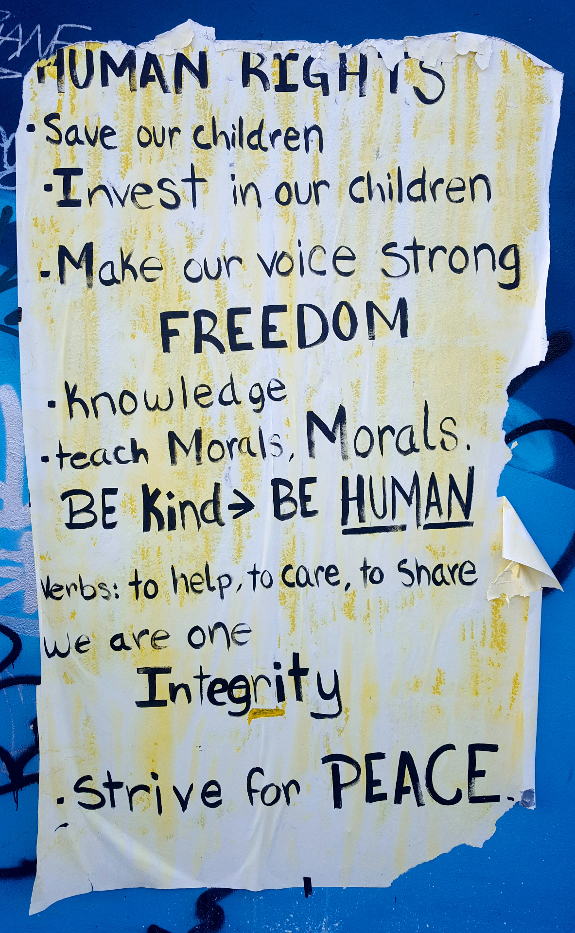 Handmade poster calling for human rights, freedom, integrity, and peace