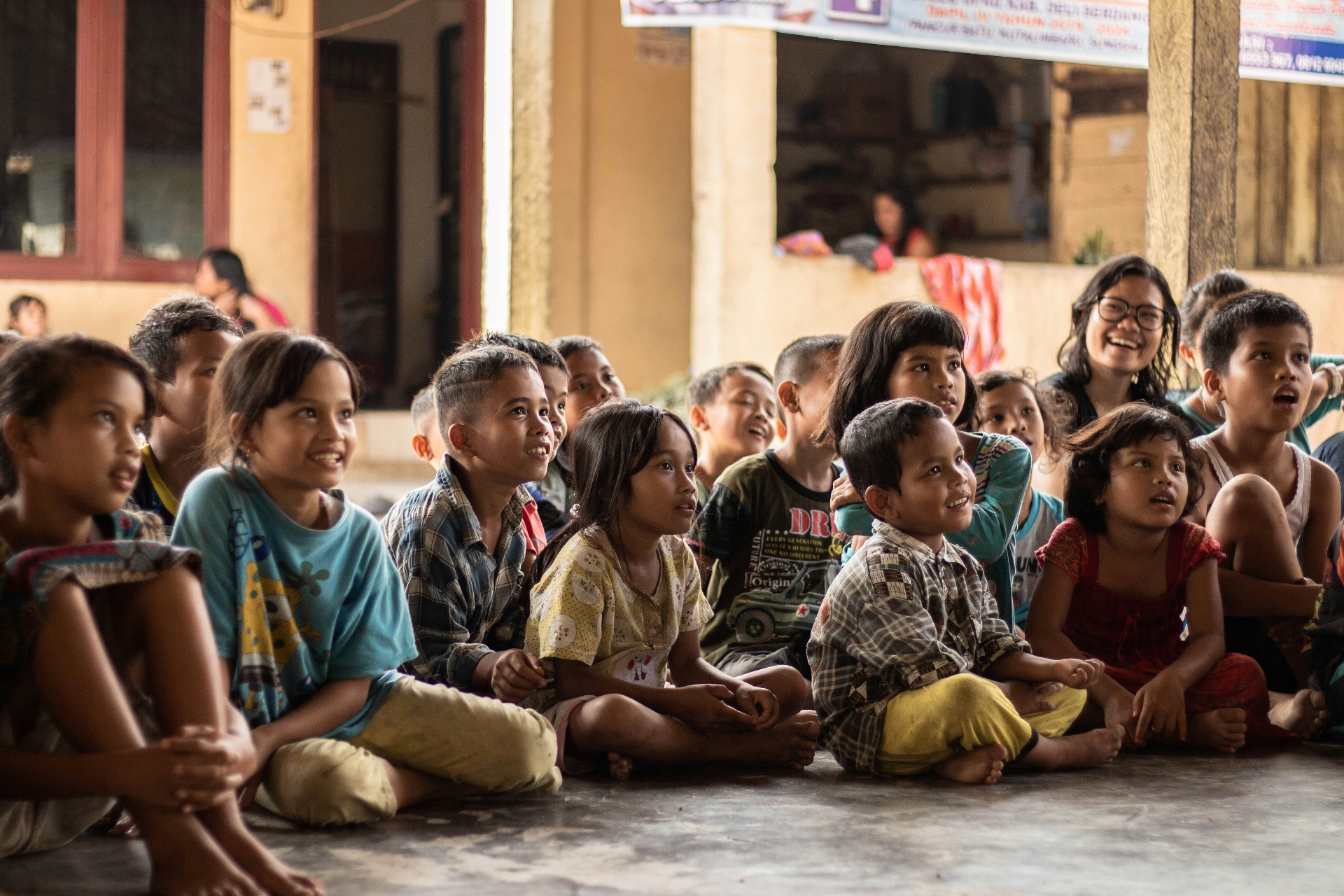 Children gathered together in a community setting